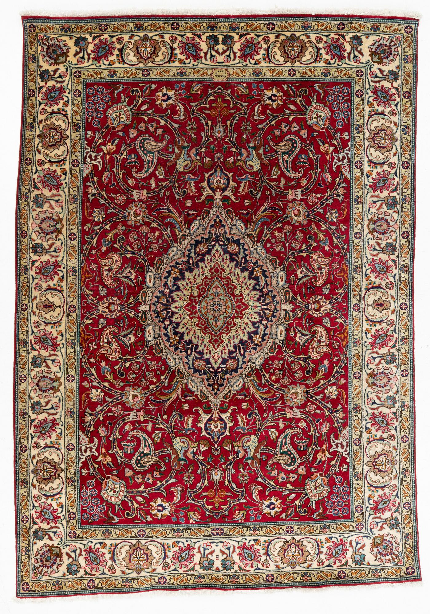 A Tabriz Carpet, circa 316 x 220 cm.