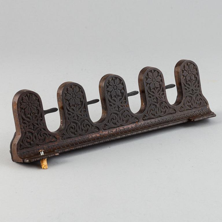 A 19th century iron umbrella and walkingstick holder.