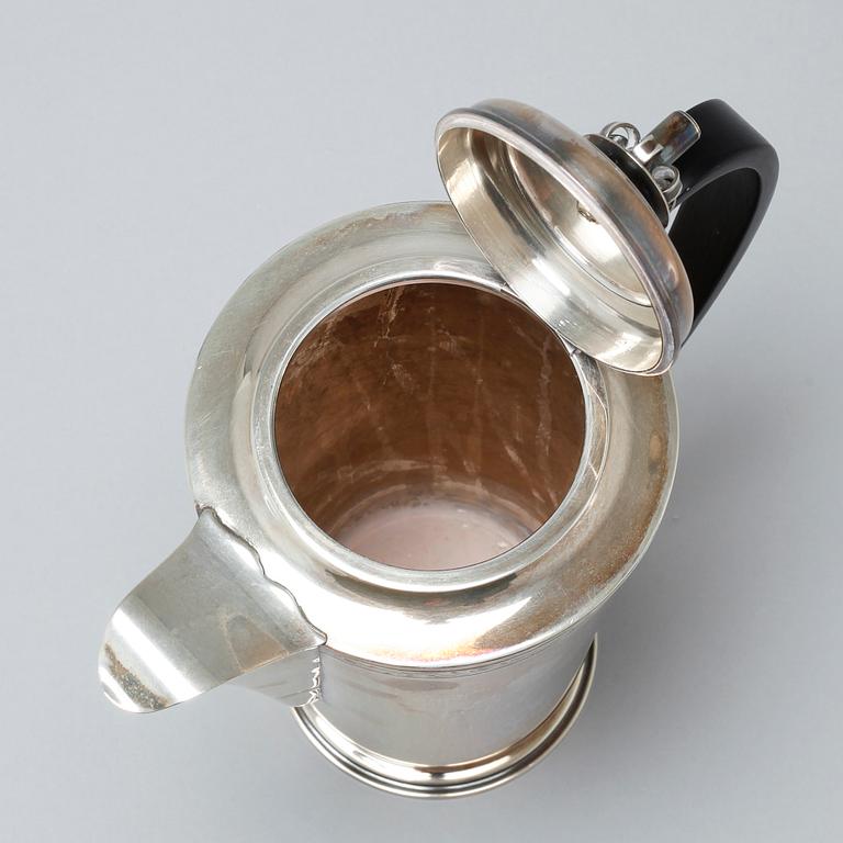 A silver coffee pot, sugar bowl and creamer by Thore Eldh for K&EC in Göteborg, 1949.