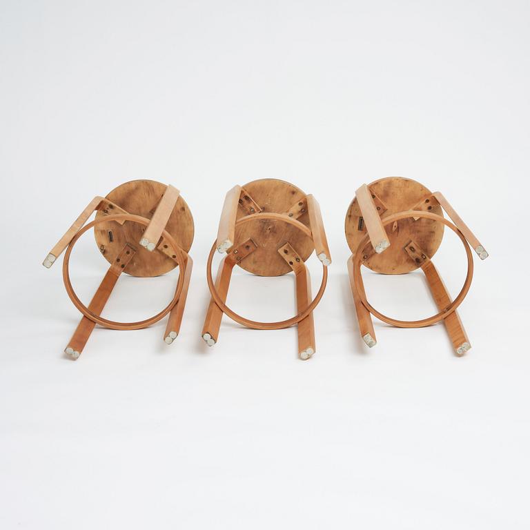 Alvar Aalto, a set of three bar stools, model "64", Finmar Ltd, Finland 1930s.