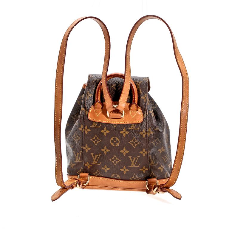A monogram canvas back-pack by Louis Vuitton.