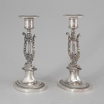 A pair of Swedish empire silver candlesticks by Adolf Zethelius, Stockholm 1826.