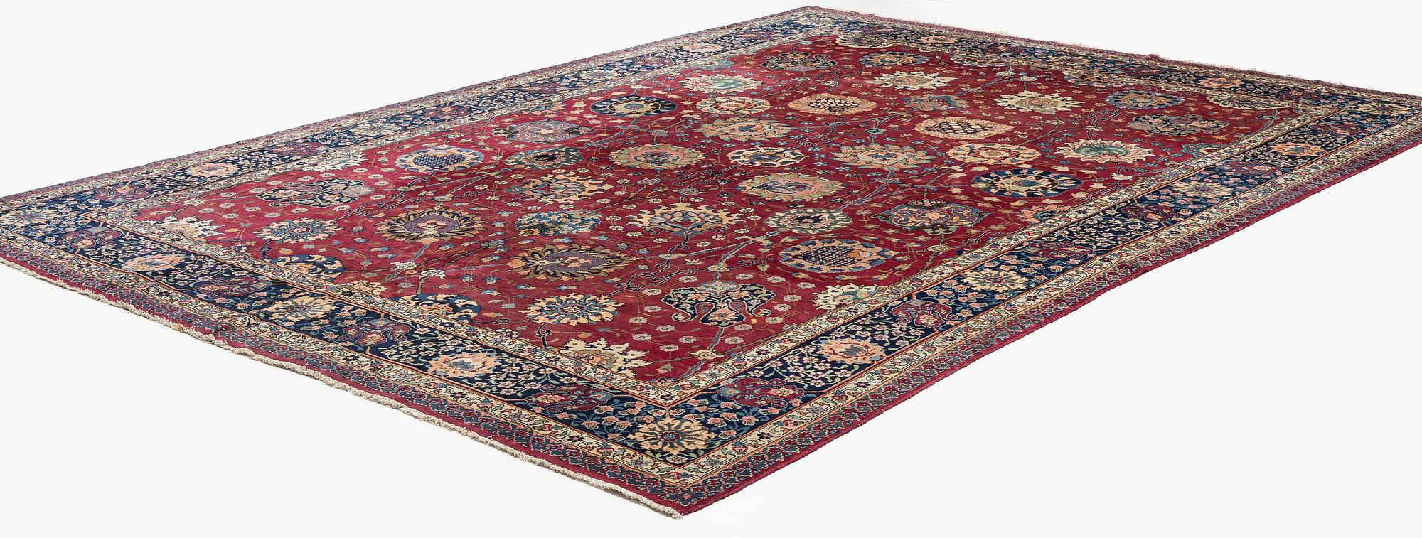 A fine Meshed carpet of 'Vase' design, North-East Persia, c. 480 x 345 cm.