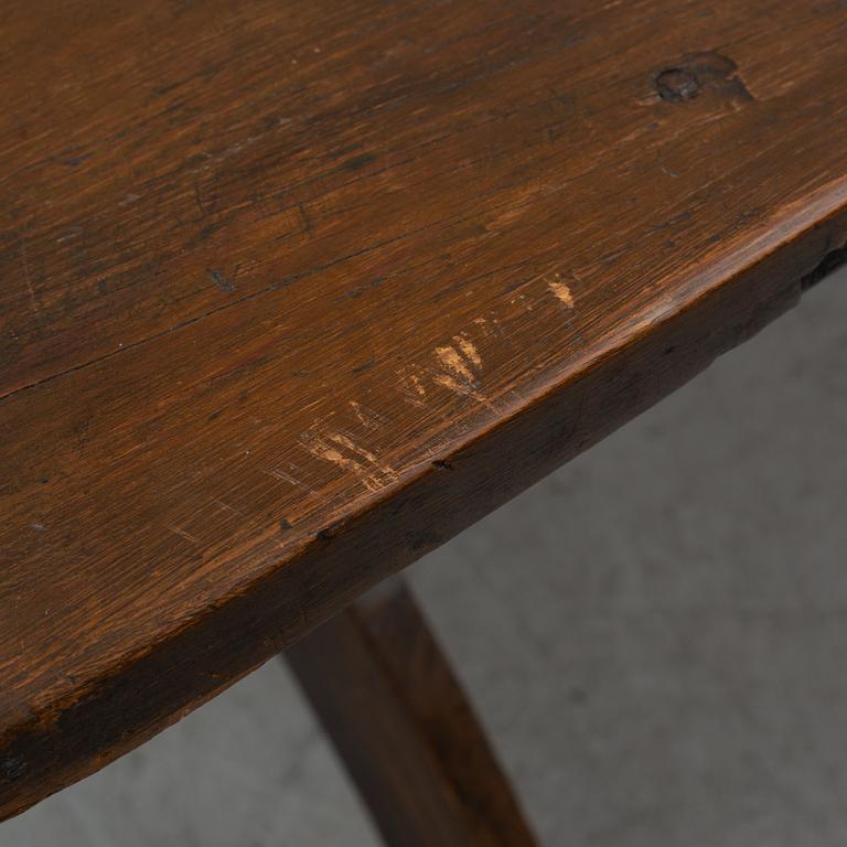 A provincial dining table and eight similar chairs, Sweden, 19th century.