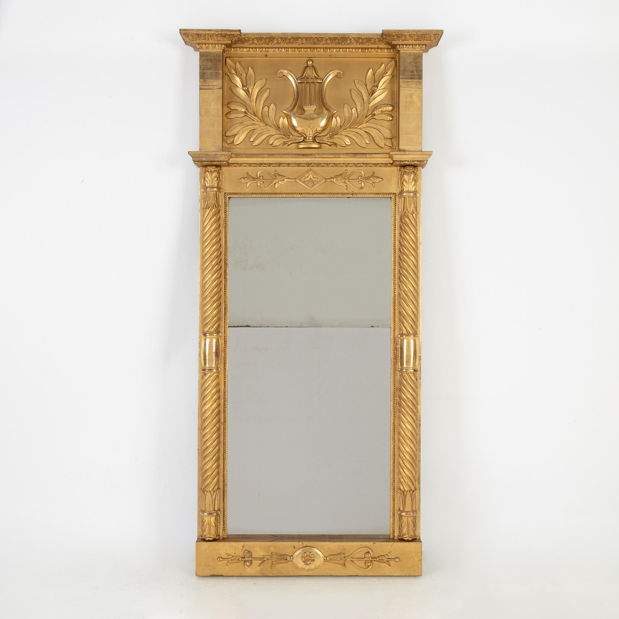 An Empire mirror, first half of the 19th Century.