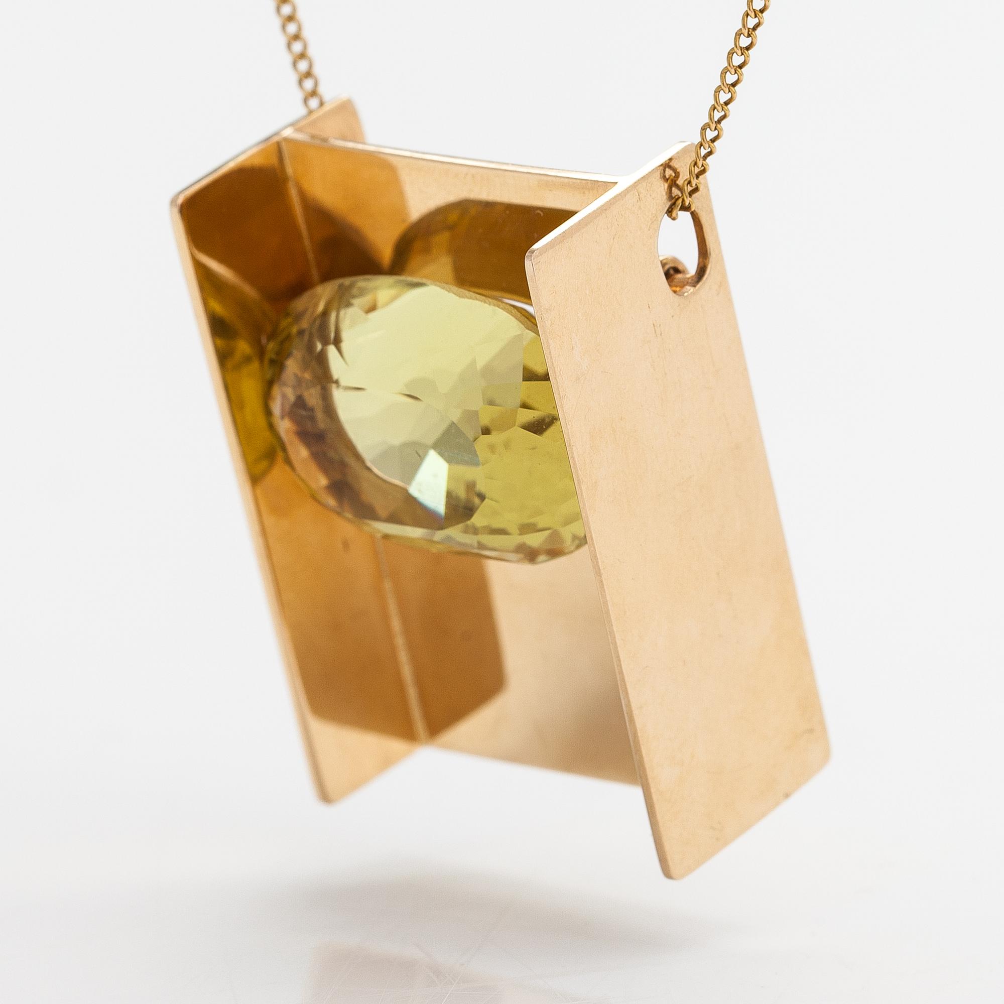 Markku Liitola, A 14K gold necklace/brooch with a heliodor/yellow beryl. Turku 1992.
