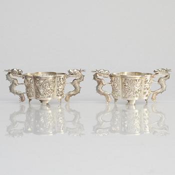 A pair of  Chinese silver cup holders/salts, 20th century.