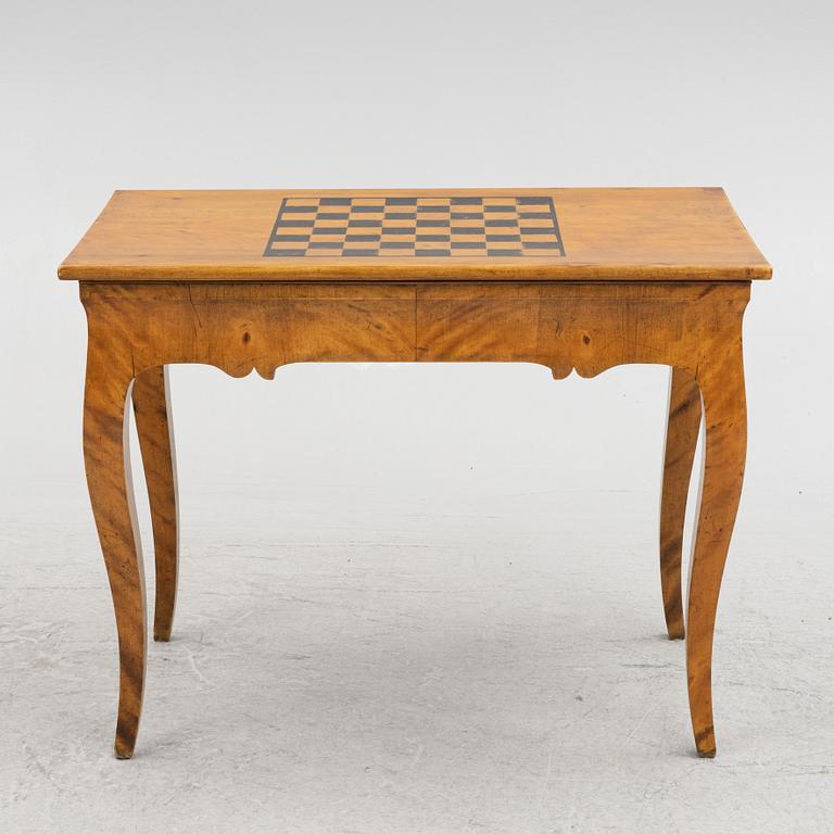 A Rococo style games table, first half of the 19th Century.