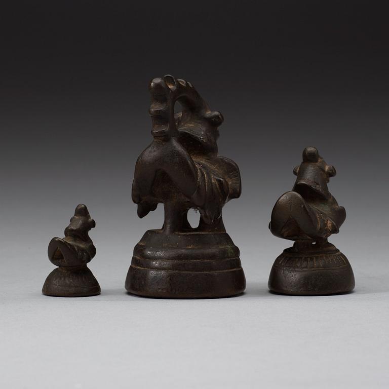 A set of eight Burmese bronze weights, 19th century.