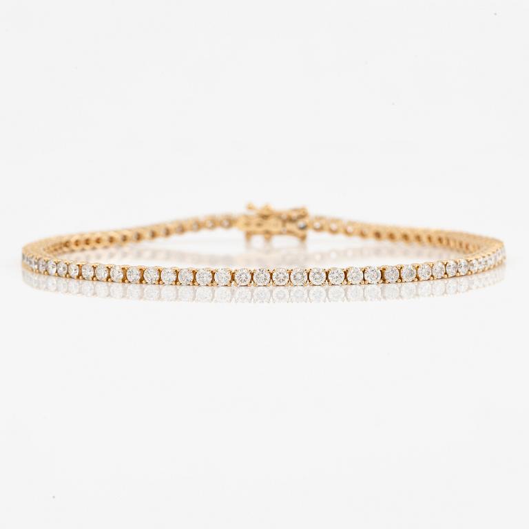 Tennisarmband 18K guld med briljantslipade diamanter.