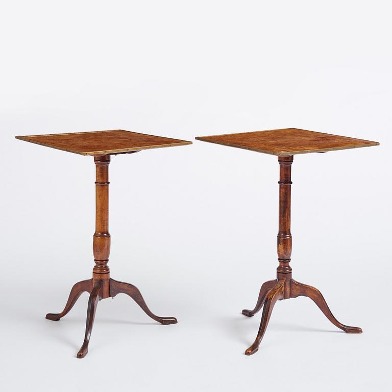 A pair of alder-veneered tilt-top tables by C. Hollst (master 1787-1830).