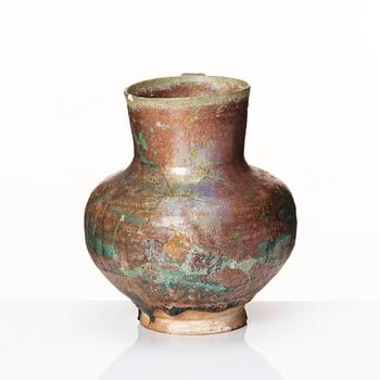 A 12-13th century turquoise and black underglazed jug.