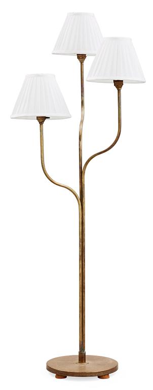 A brass floor-lamp attributed to G.A. Berg, Sweden 1940's.