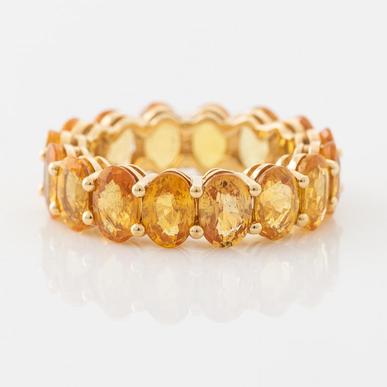 Oval yellow sapphire ring.