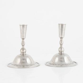 Firma Svenskt Tenn, a pair of pewter candlesticks model "76", Stockholm 1925.