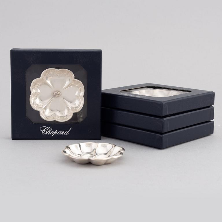 De Grisogono, a set of five silver dishes, Chopard, Switzerland.