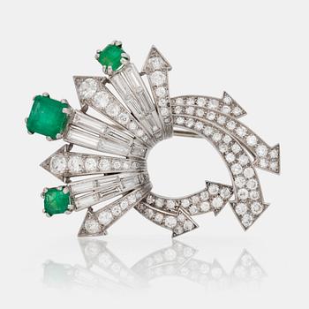 734. A Sterlé diamond and emerald brooch. Circa 1940-50, Paris.