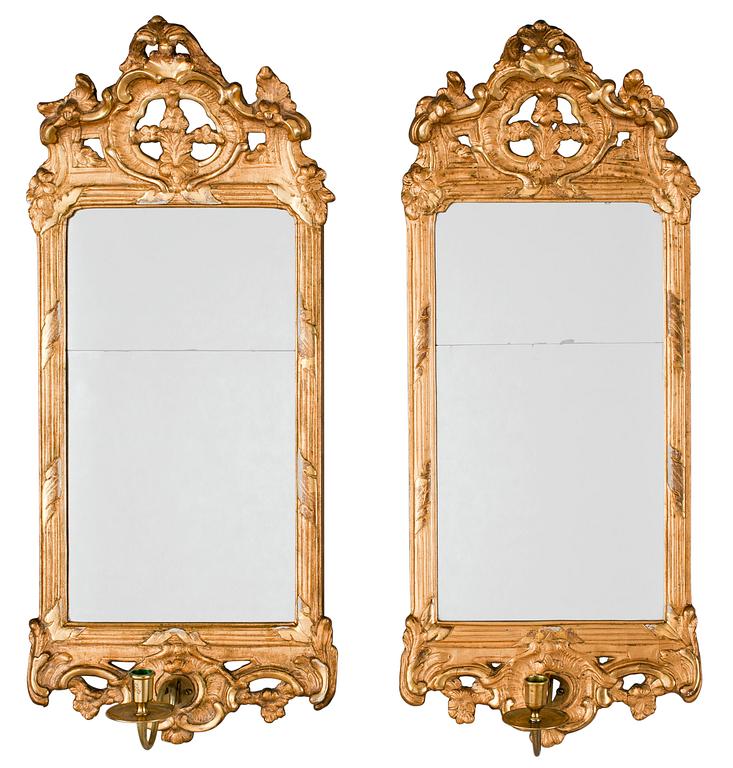 A pair of Swedish Rococo one-light girandole mirrors by N. Meunier.
