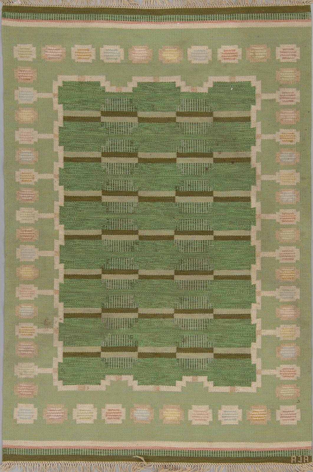 A CARPET, flat weave, ca 247 x 167,5 cm, signed AJA.