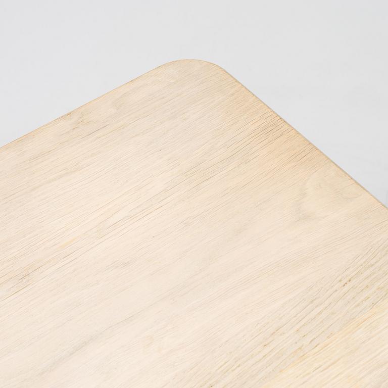 A steel and oak table by Jonas Lindvall 2011.