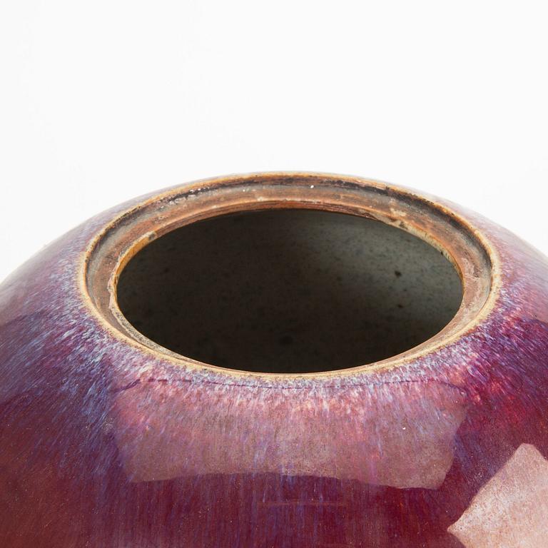 A sang de boef/flambe glazed jar with cover, Qing dynasty, circa 1900.