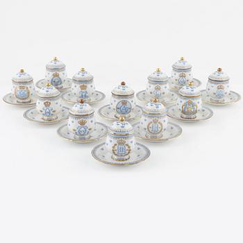 Twelve porcelain custard cups with lids and saucers, Rörstrand, second half of the 20th Century.