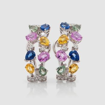 1425. A pair of sapphire and diamond earrings. Total carat weight of sapphires 4.26 cts and diamonds 0.38 ct.