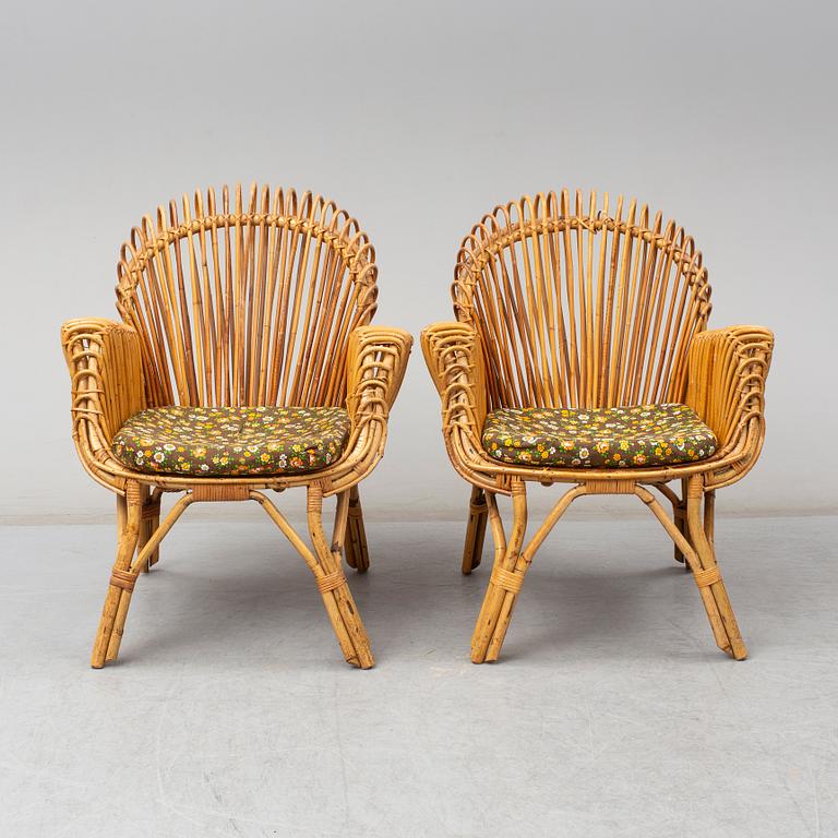 A pair of rattan armchairs, Emilio Paoli, via Vigna Nuova, 8, Firenze, Italy, second half of the 20th century. Signed.
