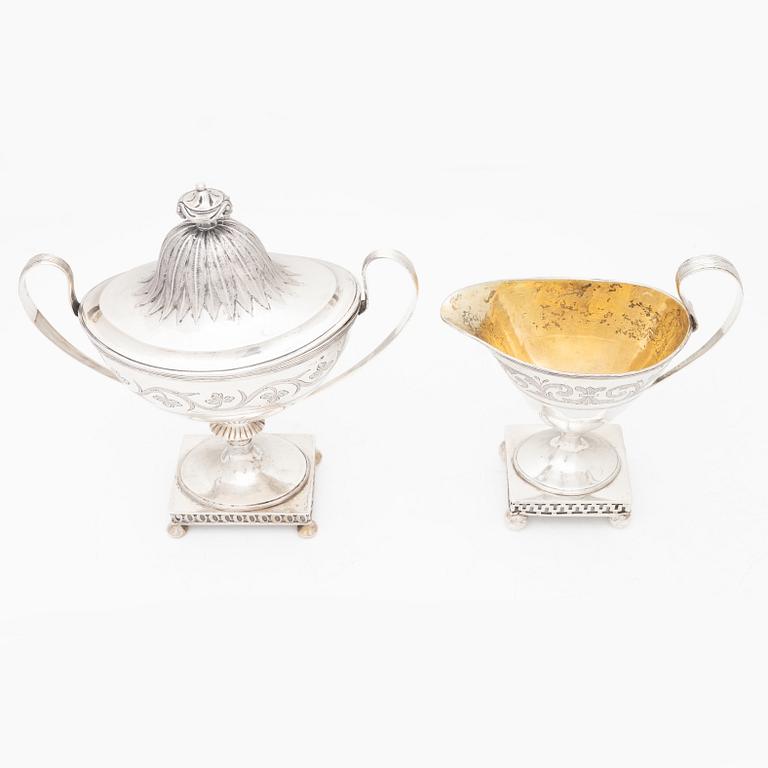 A silver sugarbowl with lid and a creamer, marks of Olof Hellbom, Stockholm, Sweden 1799-1800.