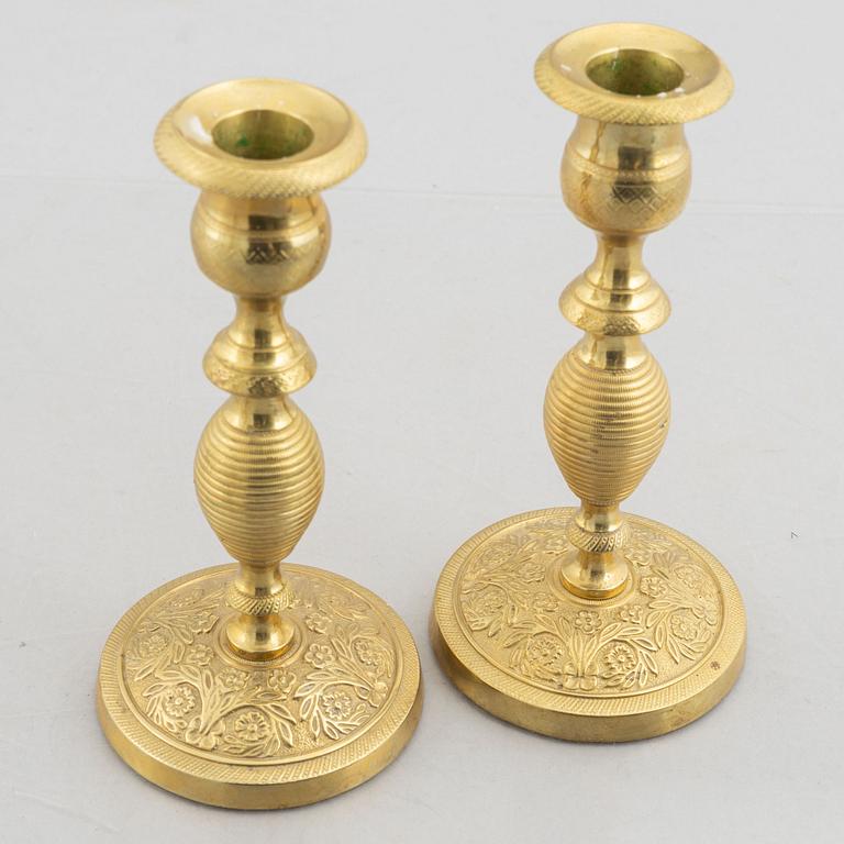 A pair of brass candlesticks, first half of the 19th Century.