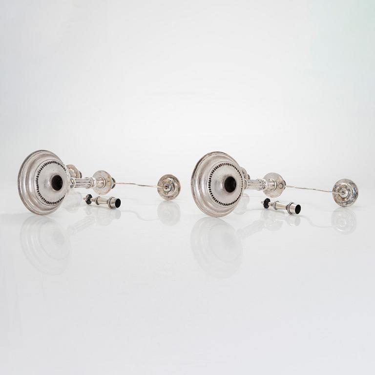 A pair of silver candelabra by Ferdinand Christian Krebs, Breslau, 1776-1792, with snuffers from Reval. Neo-classicism.