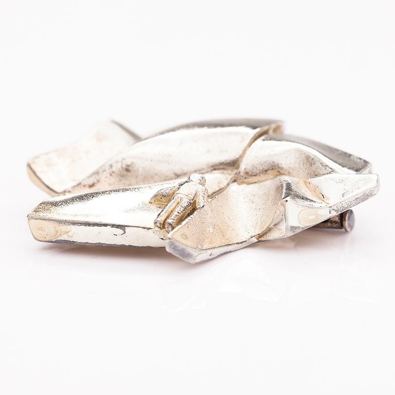 BJÖRN WECKSTRÖM, A sterling silver brooch "The stranger on Io". Lapponia 1974.
