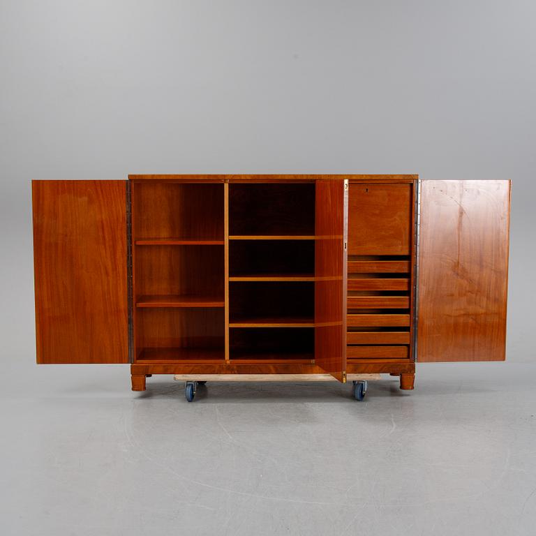A 1940's Swedish Modern mahogany veneered cabinet.