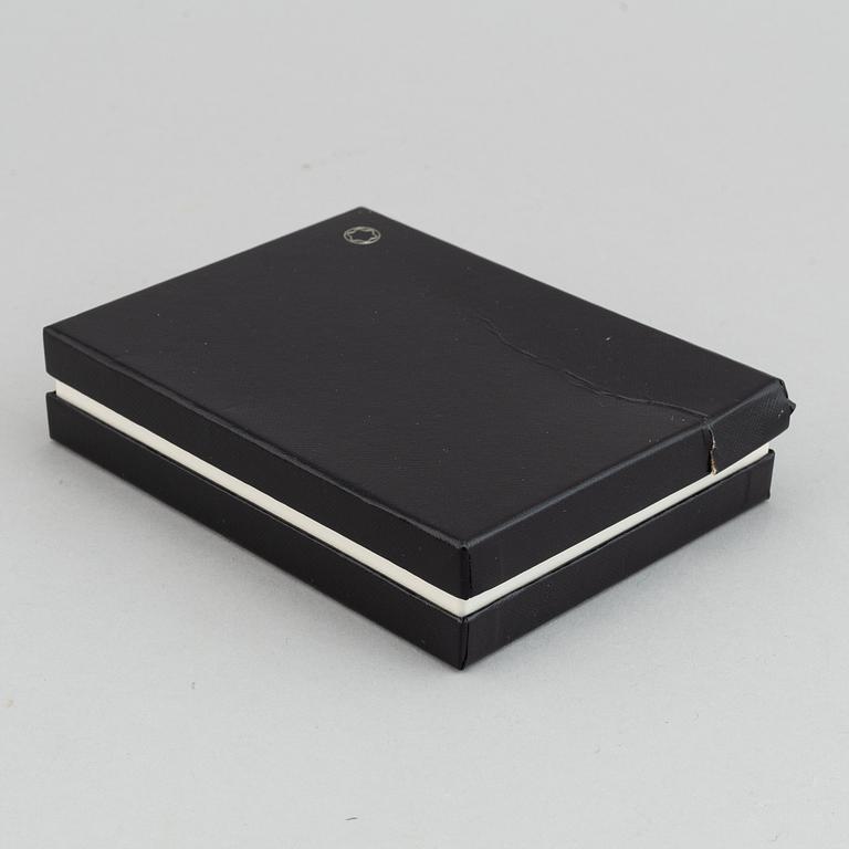 MOntblanc, a ball point pen and leather passport holder.