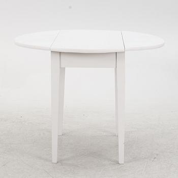 A drop-leaf table, early 20th Century.