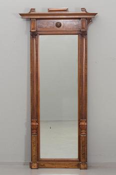 An early 20th century empire style mirror.