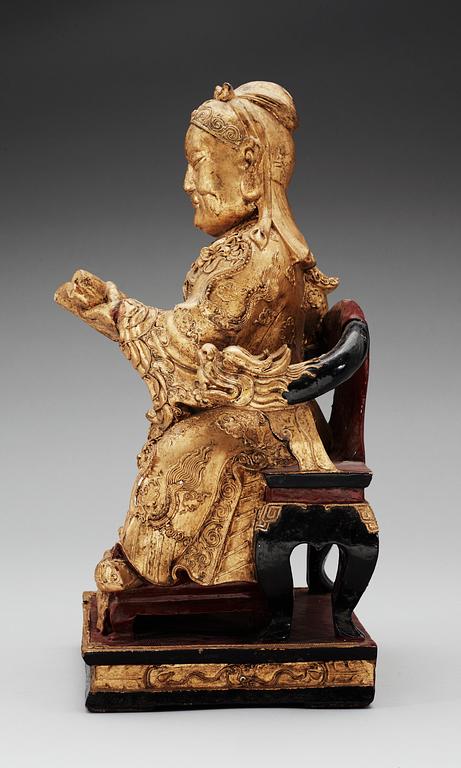 A wooden, gilt and lacquered figure of an chinese general, Qing dynasty, presumably Qianlong (1736-95).