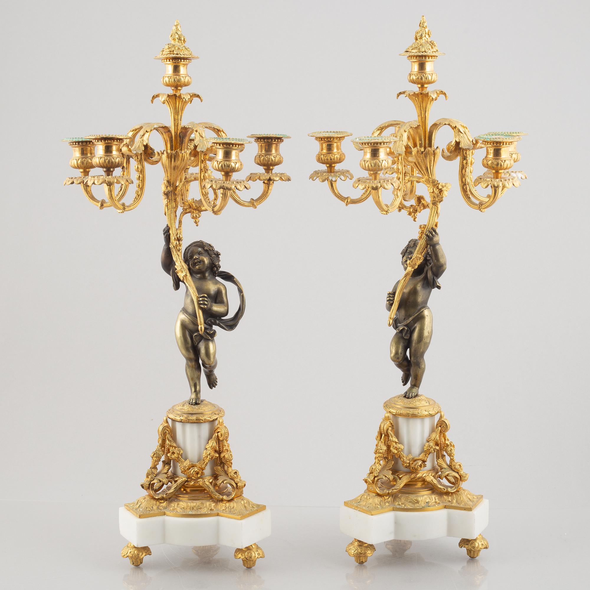 A pair of bronze and marble candelabra, possibly France, late 19th century.