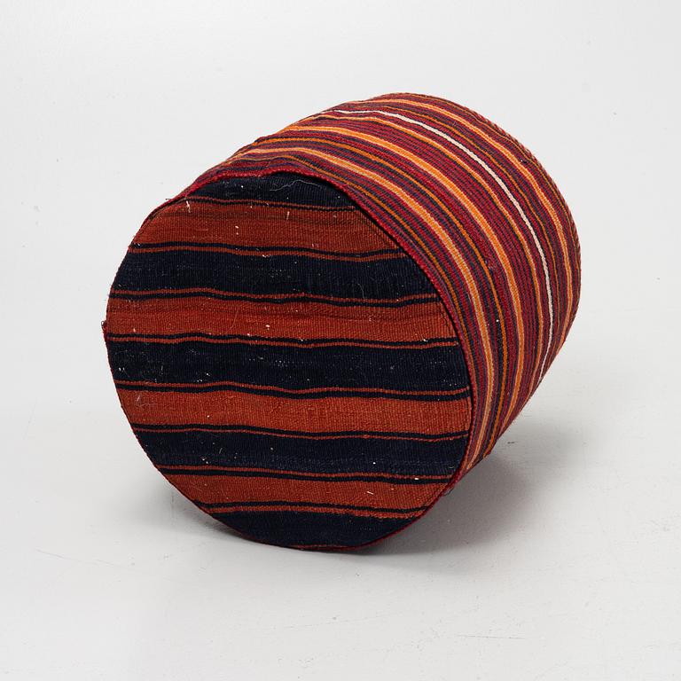 A Kelim covered stool.