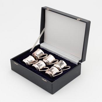 Six parcel-gilt sterling silver jugs.