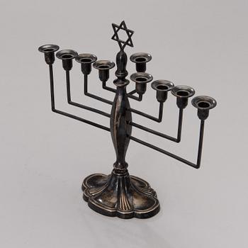 A chanukiah / menorah silver candelabrum for nine candles, mark of Britton, Gould & Co, Birmingham 1933.