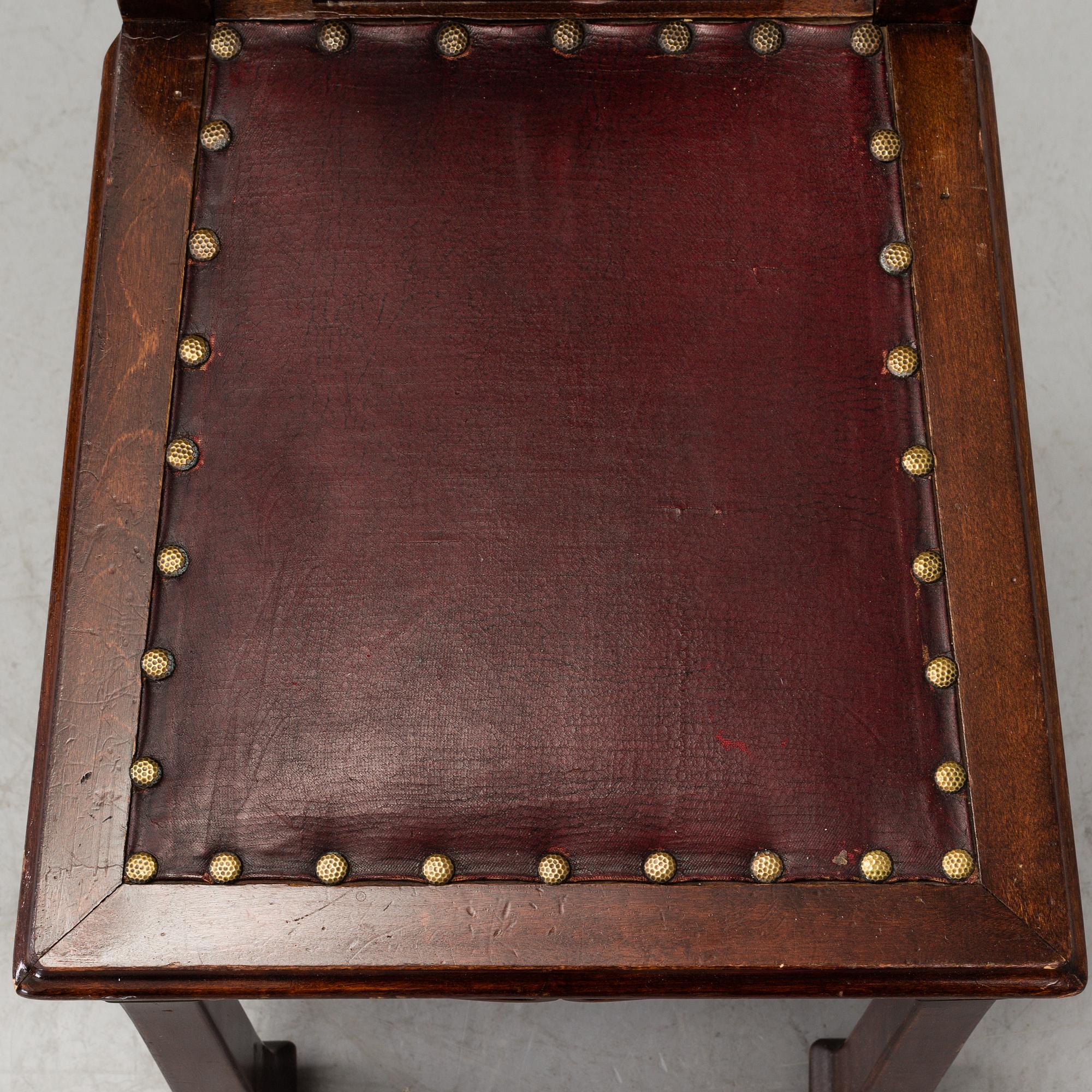 A late 19th century dining table with ten chairs and five extension leaves.