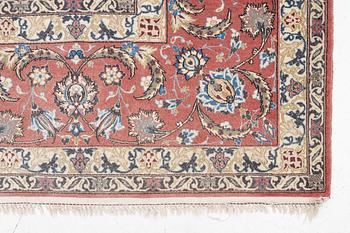 An Isfahan carpet, signed, approx. 372 x 255 cm.