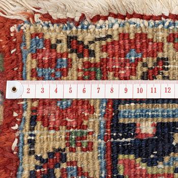 An Antique Heriz carpet, North west persia, c. 380 x 310 cm.