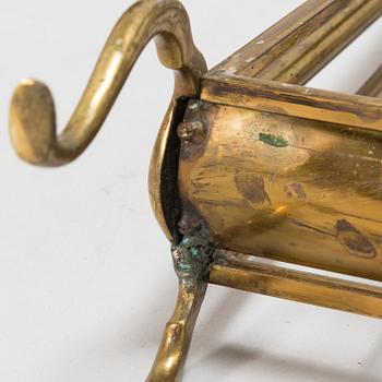 A folding brass magazine stand, first half of the 20th century.