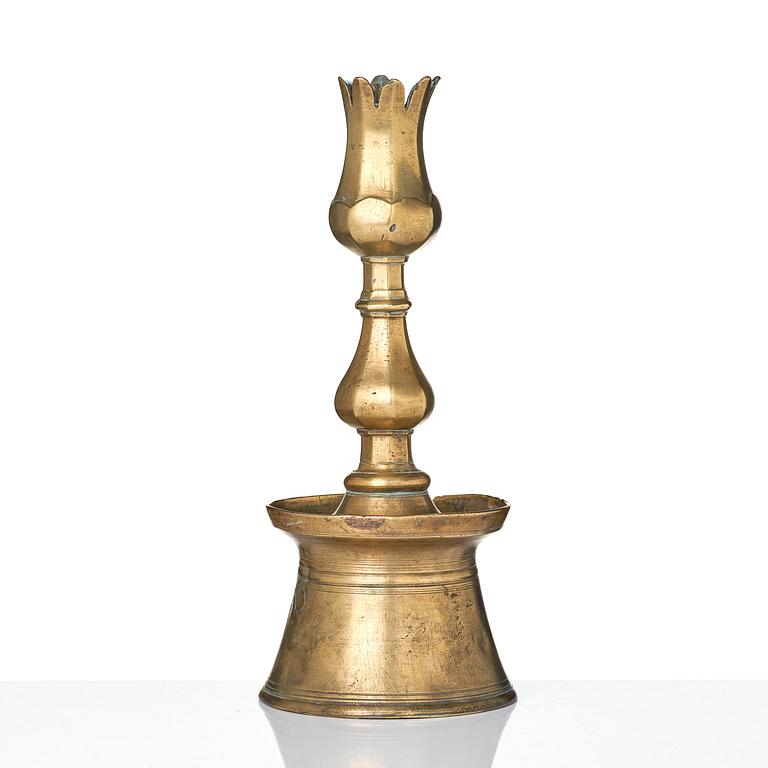 An Ottoman brass 'Tulip' Candelstick, Turkey, 17th/18th century.