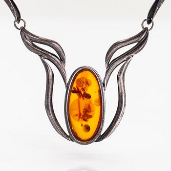 A silver and amber necklace.