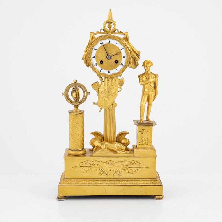 A French Empire ormolu figural mantel clock, early 19th century.