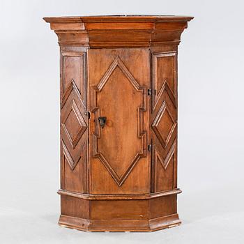 A 18th century corner cabinet.