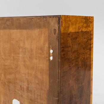 A stained birch veneered bookcase with cabinet, 1930's.